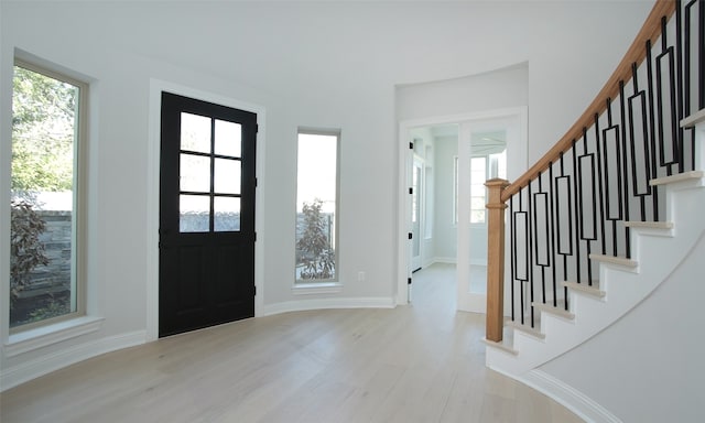 foyer with light hardwood / wood-style flooring