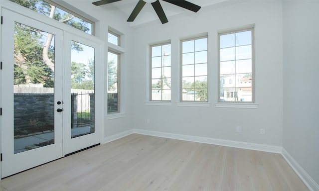 interior space with ceiling fan and french doors