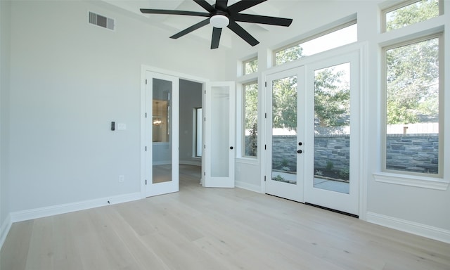 interior space featuring ceiling fan and french doors