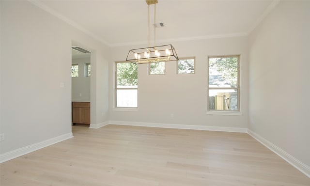 empty room with a notable chandelier, light wood-type flooring, and ornamental molding