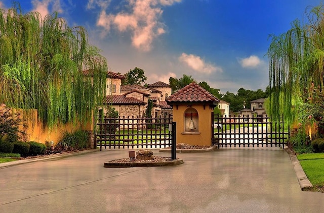 view of gate at dusk