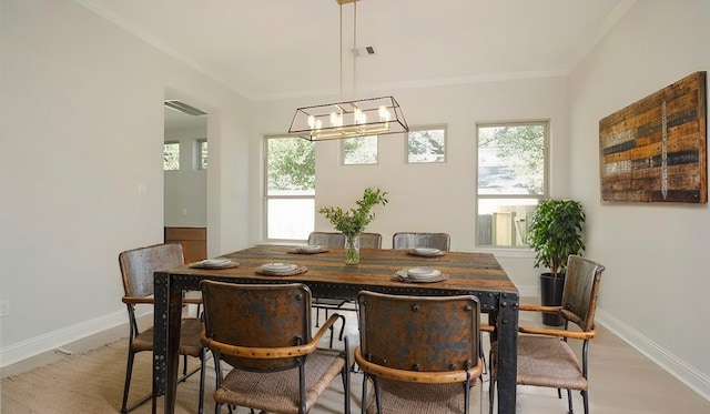 dining room featuring light hardwood / wood-style floors and a chandelier