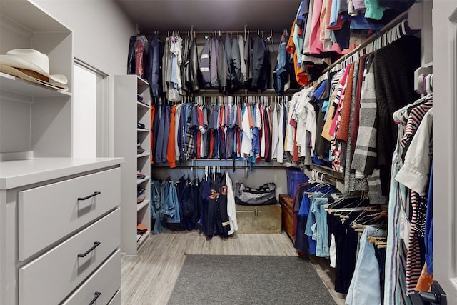 spacious closet featuring light hardwood / wood-style floors