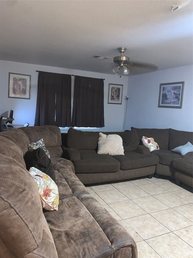 living room featuring ceiling fan and light tile patterned floors