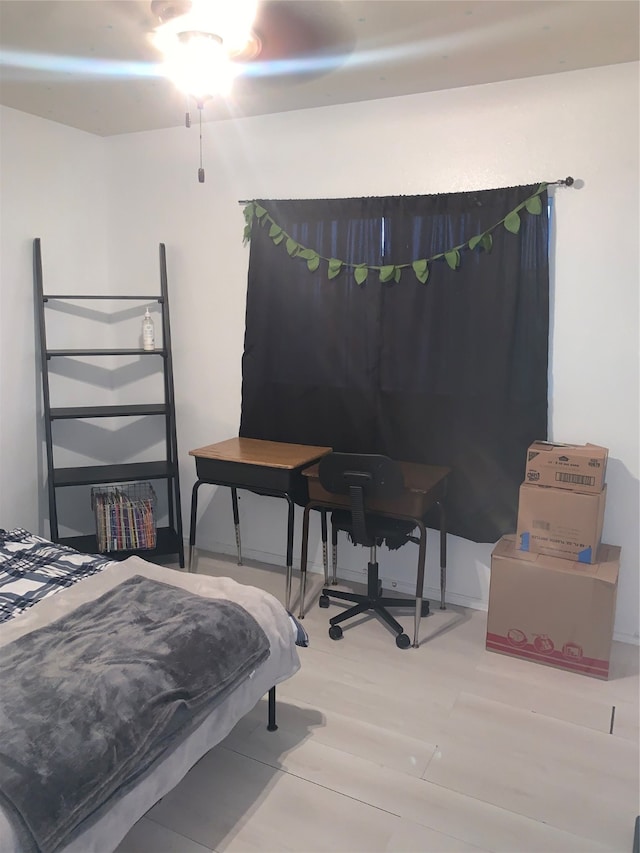 bedroom with hardwood / wood-style floors