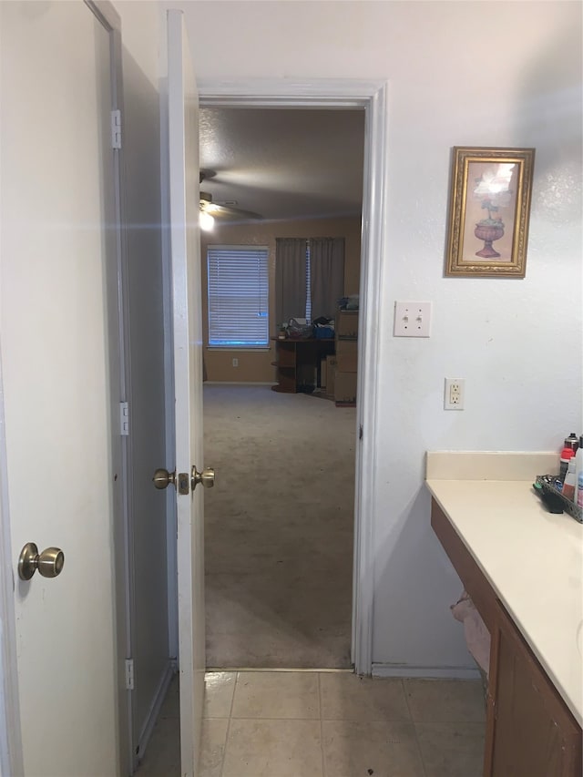 bathroom with ceiling fan and vanity