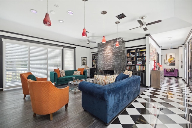 living room with ceiling fan, dark wood-type flooring, and ornamental molding