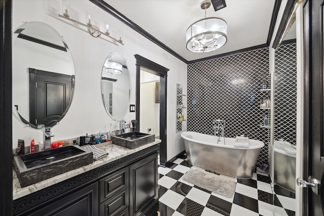 bathroom with vanity, a bathtub, and crown molding