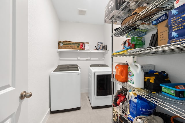 washroom featuring washer and dryer