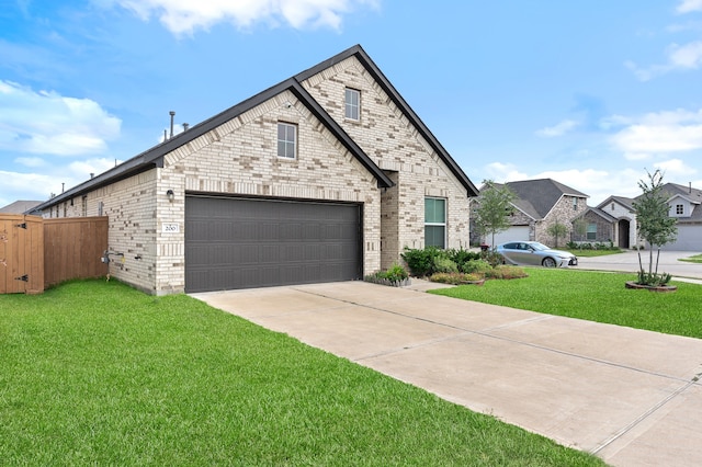 view of front of property featuring a garage and a front lawn