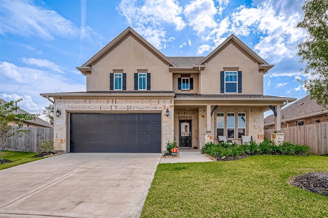 view of front of property with a garage, driveway, a front yard, and fence