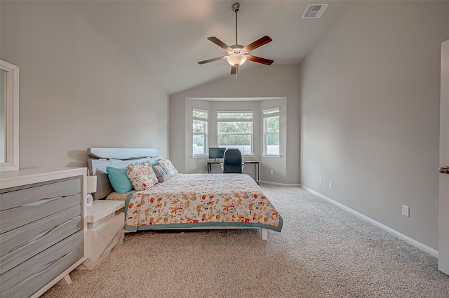 carpeted bedroom with vaulted ceiling and ceiling fan