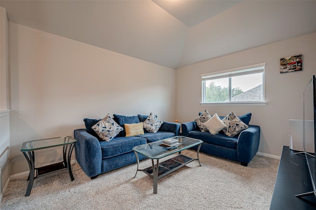 living room with lofted ceiling and carpet floors