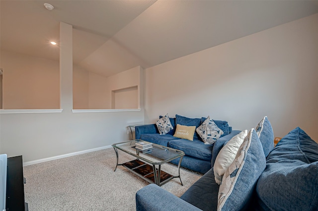 living room featuring carpet flooring and vaulted ceiling