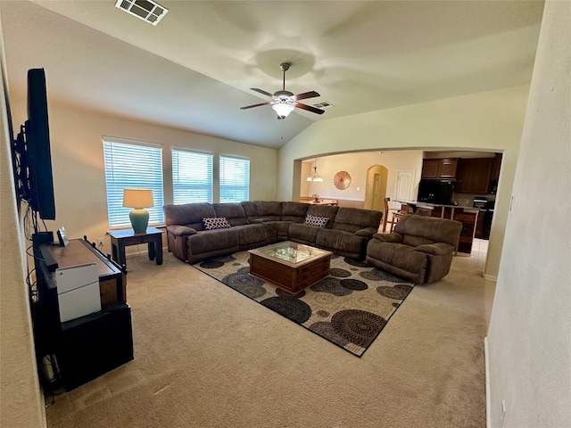 carpeted living room featuring lofted ceiling and ceiling fan