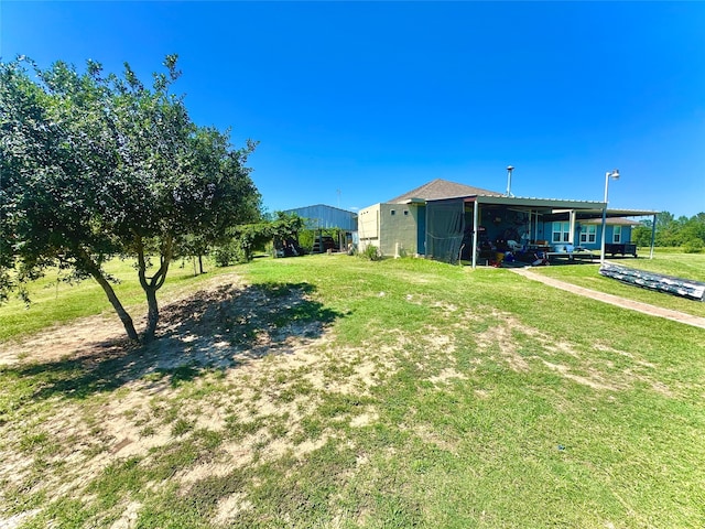 view of yard with a carport