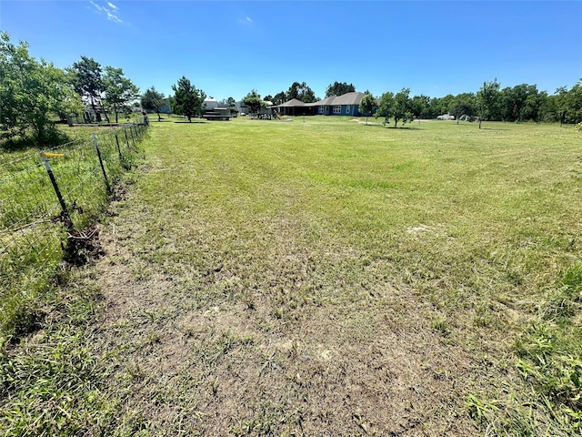 view of yard with a rural view