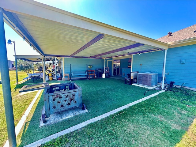 exterior space featuring a lawn and cooling unit