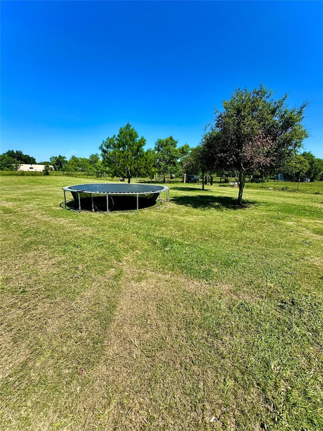 view of yard with a trampoline