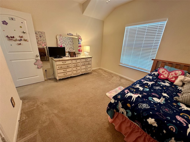 carpeted bedroom with vaulted ceiling