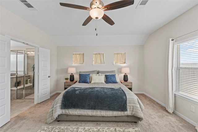 bedroom with ceiling fan, light colored carpet, a closet, and vaulted ceiling