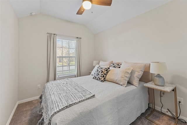 carpeted bedroom with vaulted ceiling and ceiling fan