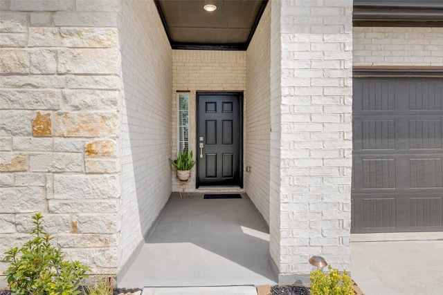 entrance to property featuring a garage