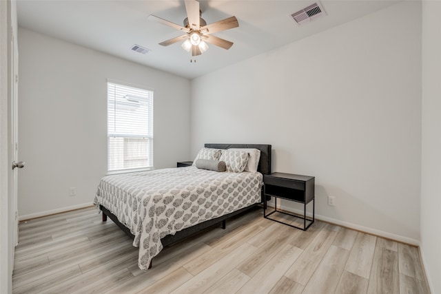 bedroom featuring light wood-type flooring and ceiling fan