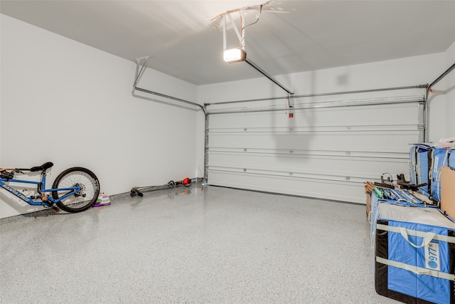 garage featuring a garage door opener