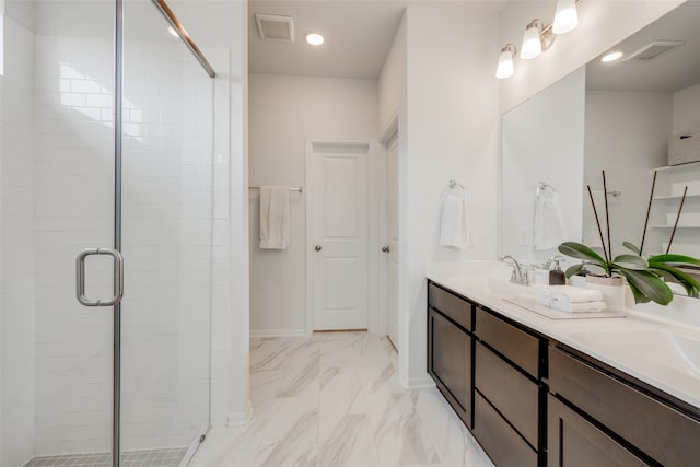 bathroom featuring vanity and a shower with door