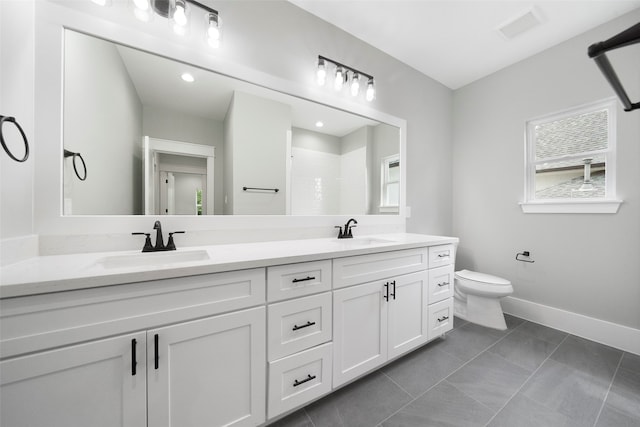 bathroom with tile patterned flooring, a shower, vanity, and toilet