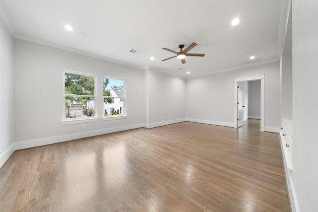 unfurnished room with ceiling fan, light hardwood / wood-style floors, and ornamental molding