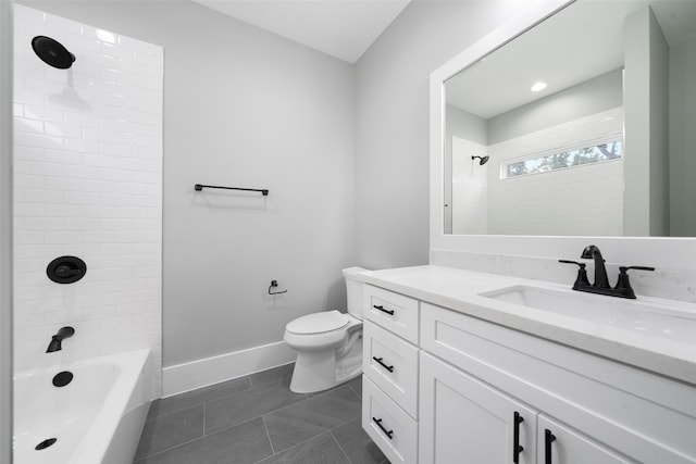 full bathroom featuring tile patterned flooring, vanity, tiled shower / bath combo, and toilet