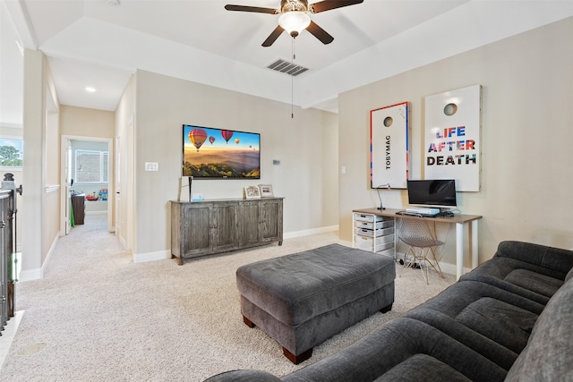 carpeted living room featuring ceiling fan