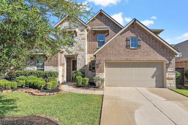 view of front of property with a front lawn and a garage