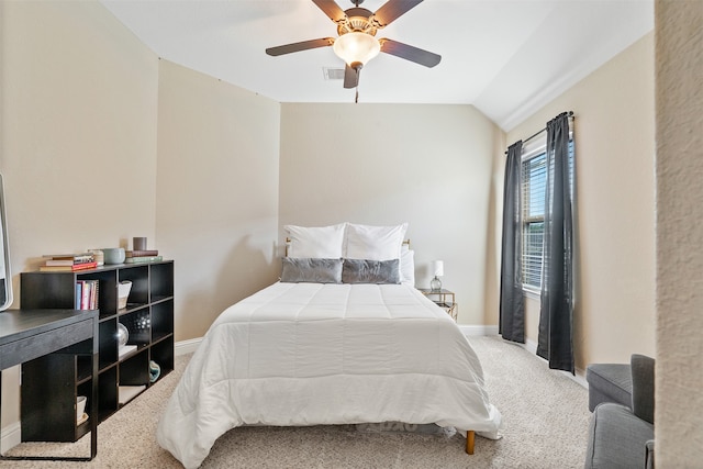 carpeted bedroom featuring ceiling fan and vaulted ceiling