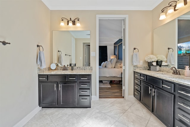 bathroom featuring ornamental molding, vanity, and hardwood / wood-style floors