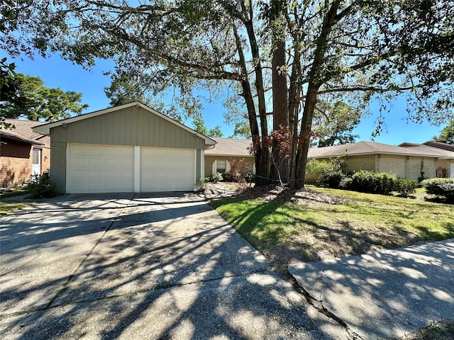 ranch-style house featuring a garage