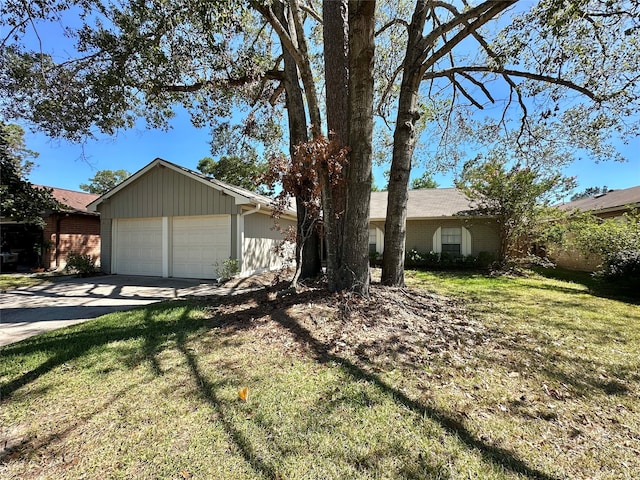 ranch-style home with a front yard and a garage