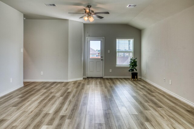 unfurnished room featuring light wood-type flooring, vaulted ceiling, and ceiling fan