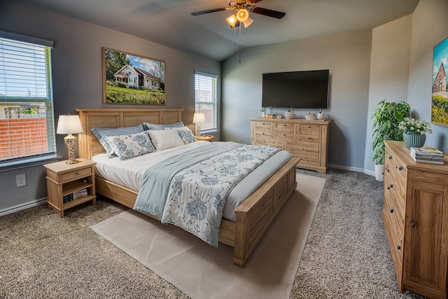 bedroom with carpet, ceiling fan, and vaulted ceiling