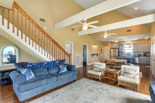 living room featuring beam ceiling, dark hardwood / wood-style flooring, ceiling fan, and high vaulted ceiling