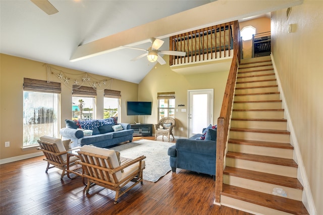 living room featuring high vaulted ceiling, dark hardwood / wood-style flooring, ceiling fan, and plenty of natural light