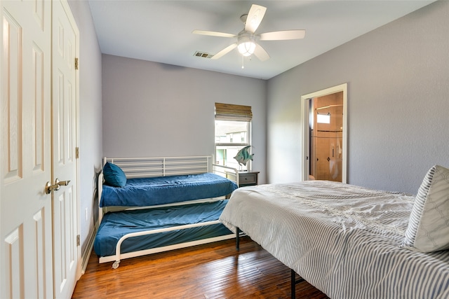 bedroom with ceiling fan and hardwood / wood-style flooring