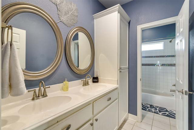 bathroom featuring vanity, tiled shower / bath combo, and tile patterned floors