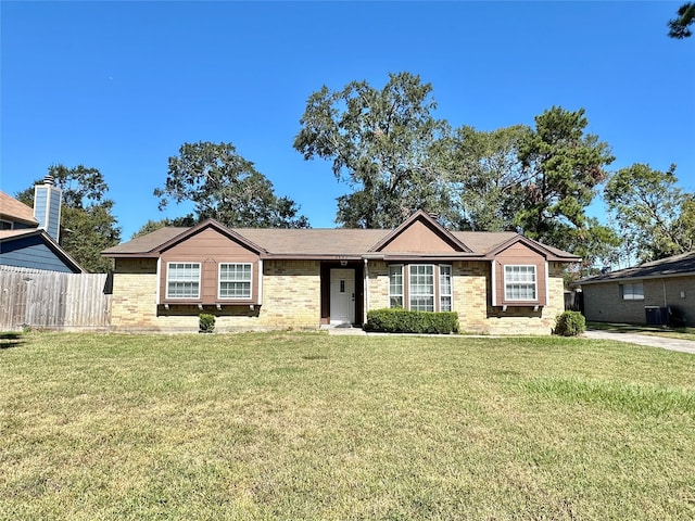 single story home with a front lawn