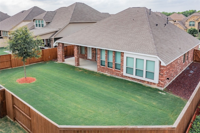 exterior space featuring a lawn and a patio area