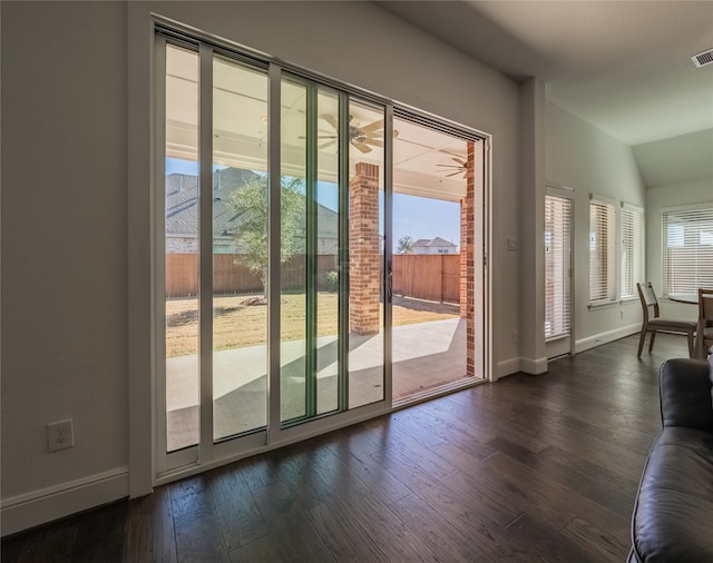 doorway to outside featuring lofted ceiling, dark hardwood / wood-style floors, and a mountain view