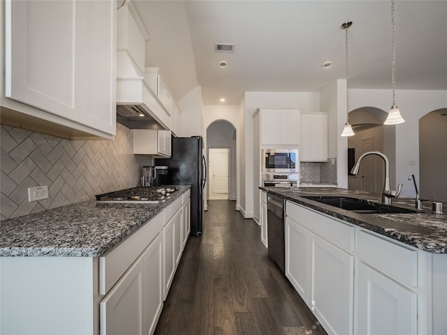 kitchen with dark hardwood / wood-style floors, white cabinetry, sink, and decorative light fixtures