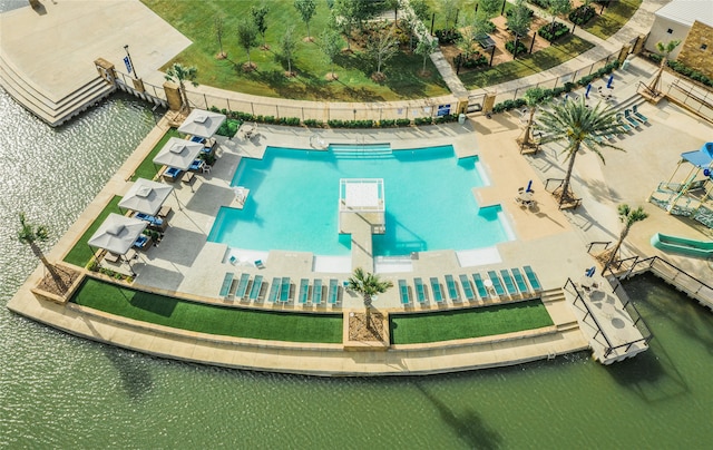 birds eye view of property with a water view